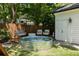 Charming backyard featuring a stock tank pool, lounge area, and a privacy fence at 1256 Euclid Ne Ave, Atlanta, GA 30307