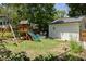 Landscaped backyard with a playset and a stock tank pool at 1256 Euclid Ne Ave, Atlanta, GA 30307