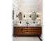 Bathroom with a dual sink vanity, floral wallpaper, and modern lighting at 1256 Euclid Ne Ave, Atlanta, GA 30307