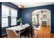 Dining room with a modern pendant light fixture and blue accent walls at 1256 Euclid Ne Ave, Atlanta, GA 30307