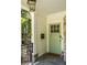 Inviting front door with black hardware, light fixture, and stone accents at 1256 Euclid Ne Ave, Atlanta, GA 30307