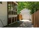 Side view of a home showing the garage and screened in porch at 1256 Euclid Ne Ave, Atlanta, GA 30307