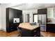 Modern kitchen features dark cabinetry and a kitchen island with seating at 1256 Euclid Ne Ave, Atlanta, GA 30307