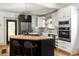 Modern kitchen features white cabinetry and a kitchen island with seating at 1256 Euclid Ne Ave, Atlanta, GA 30307