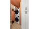 Functional laundry room with stacked washer and dryer and ample storage space at 1256 Euclid Ne Ave, Atlanta, GA 30307