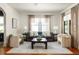 Cozy living room with lots of natural light, neutral decor and hardwood floors at 1256 Euclid Ne Ave, Atlanta, GA 30307