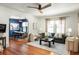 Bright open-concept living room with a dining room, ceiling fan, and hardwood floors at 1256 Euclid Ne Ave, Atlanta, GA 30307