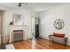 Bright living room with a fireplace, wood floors, and an open doorway at 1256 Euclid Ne Ave, Atlanta, GA 30307