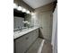 Bathroom with double granite vanity, framed mirrors, and updated lighting at 2657 Gray Mill Way, Loganville, GA 30052