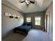A simple yet stylish bedroom with a vaulted ceiling and carpeted floors at 2657 Gray Mill Way, Loganville, GA 30052