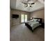 Cozy bedroom with a tray ceiling, ceiling fan, and a private balcony for relaxing at 2657 Gray Mill Way, Loganville, GA 30052