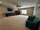 A large bonus room featuring two sitting chairs and a TV area at 2657 Gray Mill Way, Loganville, GA 30052