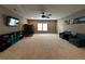 A large bonus room featuring two sitting chairs and a TV area at 2657 Gray Mill Way, Loganville, GA 30052