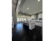 Spacious gourmet kitchen features large island, granite countertops, and stainless appliances at 2657 Gray Mill Way, Loganville, GA 30052