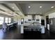 Modern eat-in kitchen with stainless appliances, central island, and view to the dining room at 2657 Gray Mill Way, Loganville, GA 30052