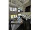Open living room with coffered ceilings, open floor plan, and modern kitchen at 2657 Gray Mill Way, Loganville, GA 30052