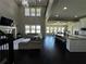 Great room showcases vaulted ceilings, fireplace, view of lake, and open concept to kitchen at 2657 Gray Mill Way, Loganville, GA 30052
