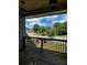 Charming porch view overlooking a landscaped front yard, a quiet neighborhood street, and mature trees at 2657 Gray Mill Way, Loganville, GA 30052