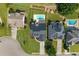 Aerial view showcasing a well-maintained home with a pool, lush landscaping, and a spacious yard at 5440 Old Haven Ct, Cumming, GA 30041