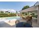 Inviting pool area with covered patio, perfect for outdoor relaxation and entertaining at 5440 Old Haven Ct, Cumming, GA 30041