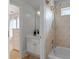 Bathroom featuring a shower-tub combination and a vanity with marble countertop and cabinets at 5440 Old Haven Ct, Cumming, GA 30041