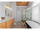 Beautiful primary bathroom with wood accents, a stand-alone tub, and a marble shower at 5440 Old Haven Ct, Cumming, GA 30041