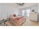 Bright bedroom featuring a ceiling fan, natural light from the windows and a neutral color scheme at 5440 Old Haven Ct, Cumming, GA 30041