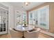 Charming breakfast nook featuring a marble table and views of the outdoor garden at 5440 Old Haven Ct, Cumming, GA 30041
