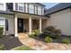 Inviting entrance with a stone walkway leading to a covered front porch at 5440 Old Haven Ct, Cumming, GA 30041