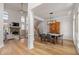 Spacious open-concept living and dining area with hardwood floors and plenty of natural light at 5440 Old Haven Ct, Cumming, GA 30041