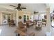 Spacious covered patio featuring comfortable wicker seating, perfect for outdoor entertaining and relaxation at 5440 Old Haven Ct, Cumming, GA 30041