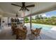 Inviting covered patio with ample seating, perfect for outdoor relaxation and overlooking the sparkling pool at 5440 Old Haven Ct, Cumming, GA 30041