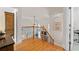 Elegant staircase with wood railing, black iron spindles, and views of the living room at 5440 Old Haven Ct, Cumming, GA 30041