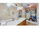 Bright bathroom featuring a long vanity, decorative shower curtain and overhead lighting at 6 Fairfield Dr, Ellenwood, GA 30294