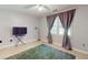 Spacious bedroom featuring neutral walls, tile flooring, and a cozy rug at 6 Fairfield Dr, Ellenwood, GA 30294