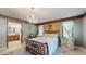 Bright bedroom with chandelier, tile floors, adjacent bathroom and large windows at 6 Fairfield Dr, Ellenwood, GA 30294