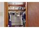 Walk-in closet featuring shelving units, shoe racks, and hanging storage at 6 Fairfield Dr, Ellenwood, GA 30294