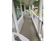 Cozy front porch with painted wood flooring and railing, perfect for relaxing and enjoying the outdoors at 6 Fairfield Dr, Ellenwood, GA 30294