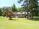 Cozy one-story home with inviting front porch and lovely landscaping at 6 Fairfield Dr, Ellenwood, GA 30294