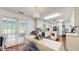 Kitchen with an island and access to the backyard through French doors at 6 Fairfield Dr, Ellenwood, GA 30294