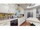 Traditional kitchen features stainless steel appliances, and white cabinets at 6 Fairfield Dr, Ellenwood, GA 30294