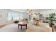 Open living room features a fireplace, bright windows, and comfortable seating at 6 Fairfield Dr, Ellenwood, GA 30294
