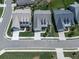 Aerial view of a neatly planned neighborhood featuring well-maintained lawns, modern homes, and landscaped yards at 603 Canyon Overlook, Canton, GA 30114