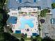 Unique pool design surrounded by seating areas, gardens, and lush landscaping from an aerial view at 603 Canyon Overlook, Canton, GA 30114