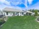 Expansive backyard featuring a covered patio, lush lawn, and manicured landscaping, perfect for outdoor enjoyment at 603 Canyon Overlook, Canton, GA 30114