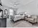 Cozy bedroom with a large window and a comfortable seating area at 603 Canyon Overlook, Canton, GA 30114