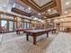 Billiard room featuring billiards tables, unique lighting, and comfortable seating at 603 Canyon Overlook, Canton, GA 30114