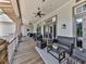 Relaxing covered patio with comfortable seating and ceiling fans, perfect for outdoor enjoyment at 603 Canyon Overlook, Canton, GA 30114