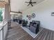 Spacious covered patio furnished with stylish seating, ideal for entertaining or quiet relaxation at 603 Canyon Overlook, Canton, GA 30114