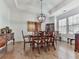 Elegant dining room with a large table, decorative lighting, and hardwood floors at 603 Canyon Overlook, Canton, GA 30114